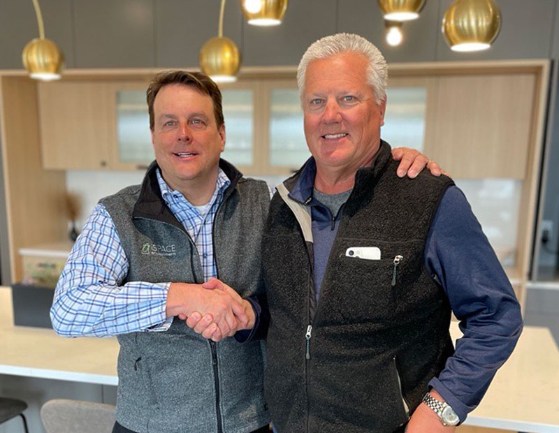 Tim Graves giving a friendly handshake to now retired Mark Drach