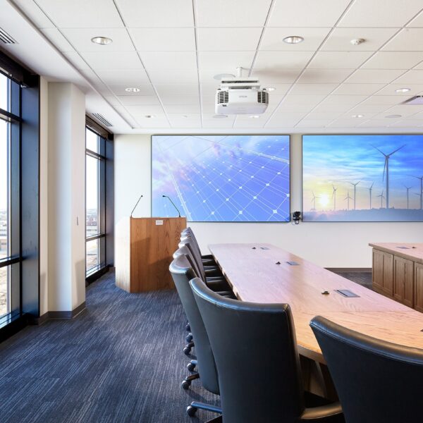 executive board room with u-shaped table and lectern at front of room