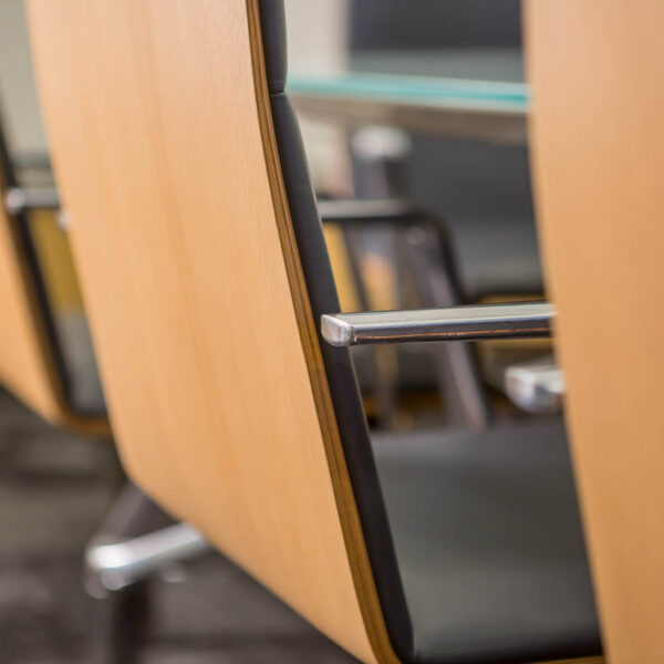 wood backs of conference chairs with metal arms