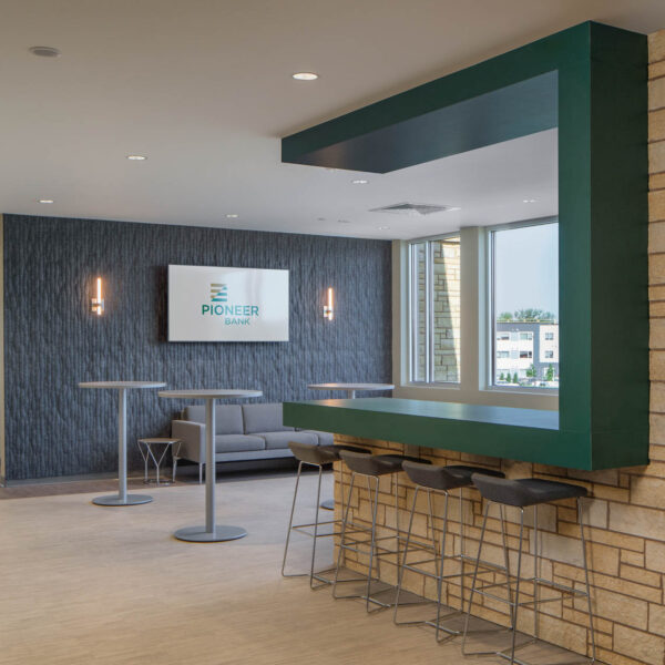 entry client entertaining space with bar stools, high top tables, and soft seating