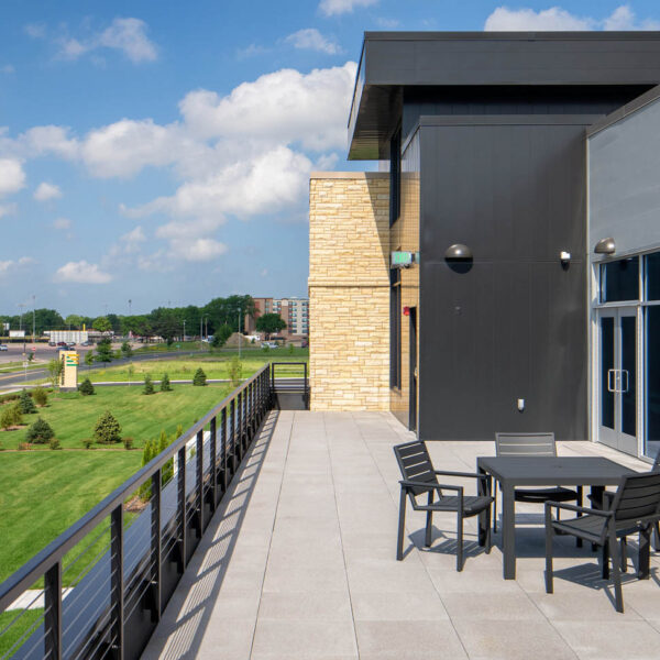 Outdoor patio area with weather-resistant table and chairs