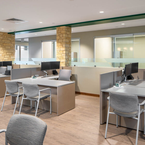 Customer experience center desks with each desk having task seating and 2 guest chairs