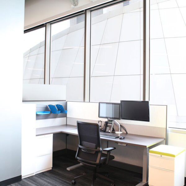 height adjustable L-shaped workstation with dual monitors and multiple storage solutions
