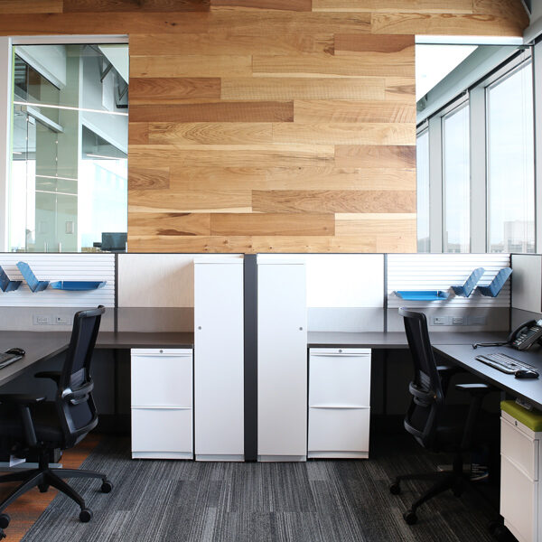 back to back L-shaped workstations with gallery panels and box files for storage