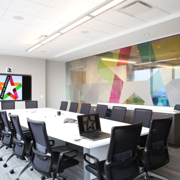 Conference room with integrated technology, ample seating, and long credenza to support all meeting types